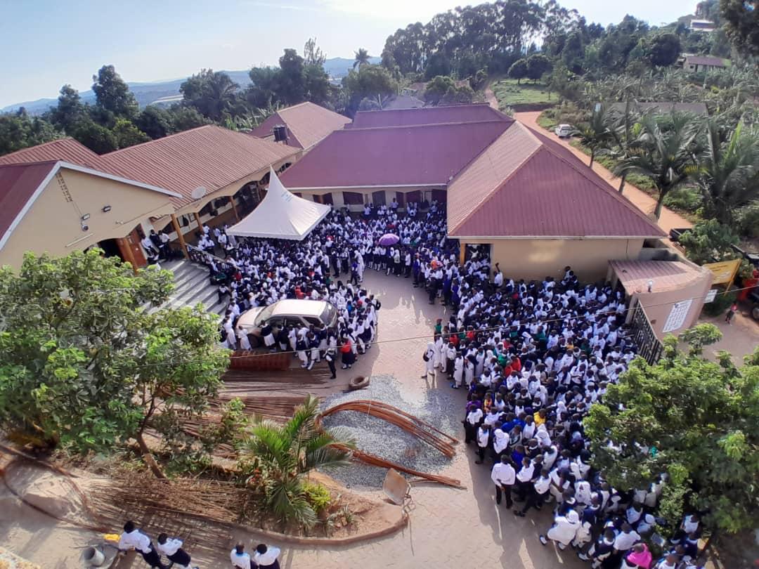 Aerial view of the Buloba Christian High School campus with the whole student body assembled in the courtyard